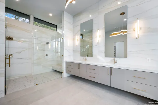 a bathroom with a double vanity sink and a mirror