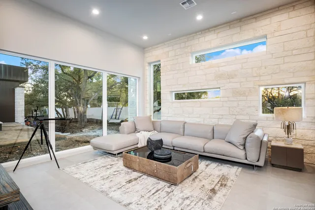 a living room with furniture and a rug