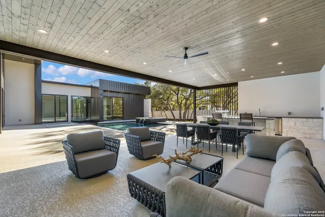 a view of a patio with a table and chairs