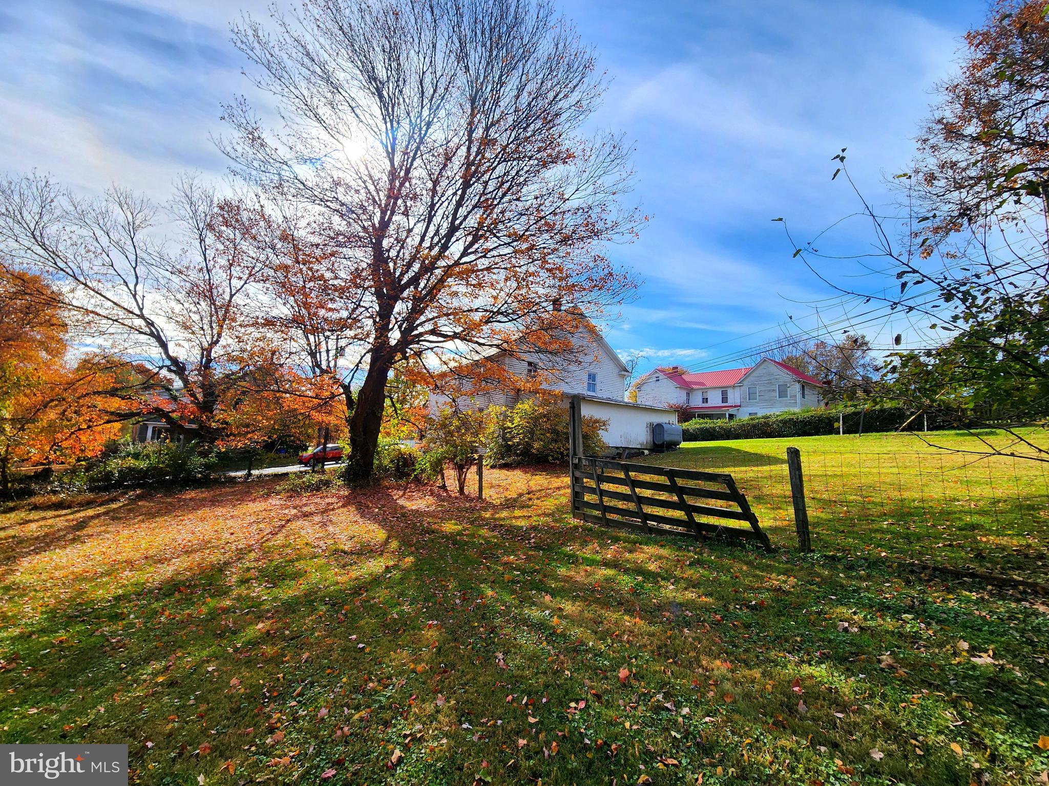 26506 Clarksburg Road Clarksburg, MD 20871 - Photo 19 of 39 a bench is sitting in the middle of a yard