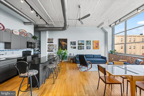 a outdoor space with lots of furniture and lots of potted plants