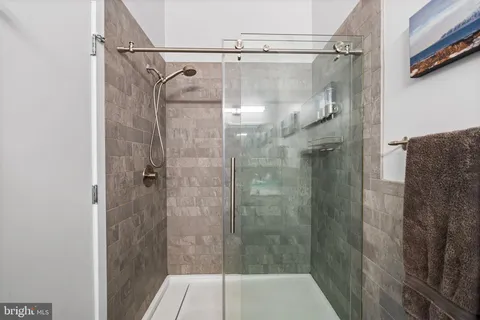 a room with furniture a flat screen tv and a fireplace