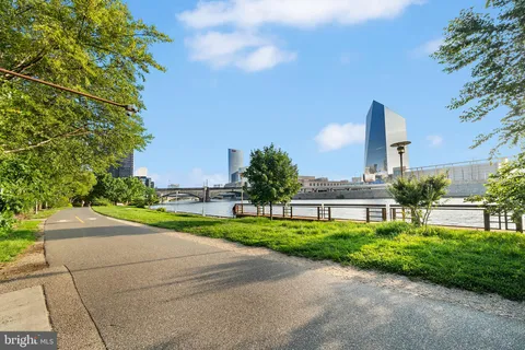 a view of a lake with a city skyline in the background