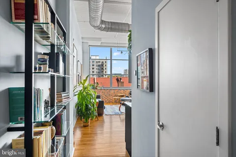 a view of a kitchen with dining table and chairs
