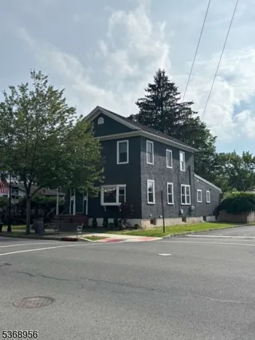 a view of swimming pool with outdoor seating and yard