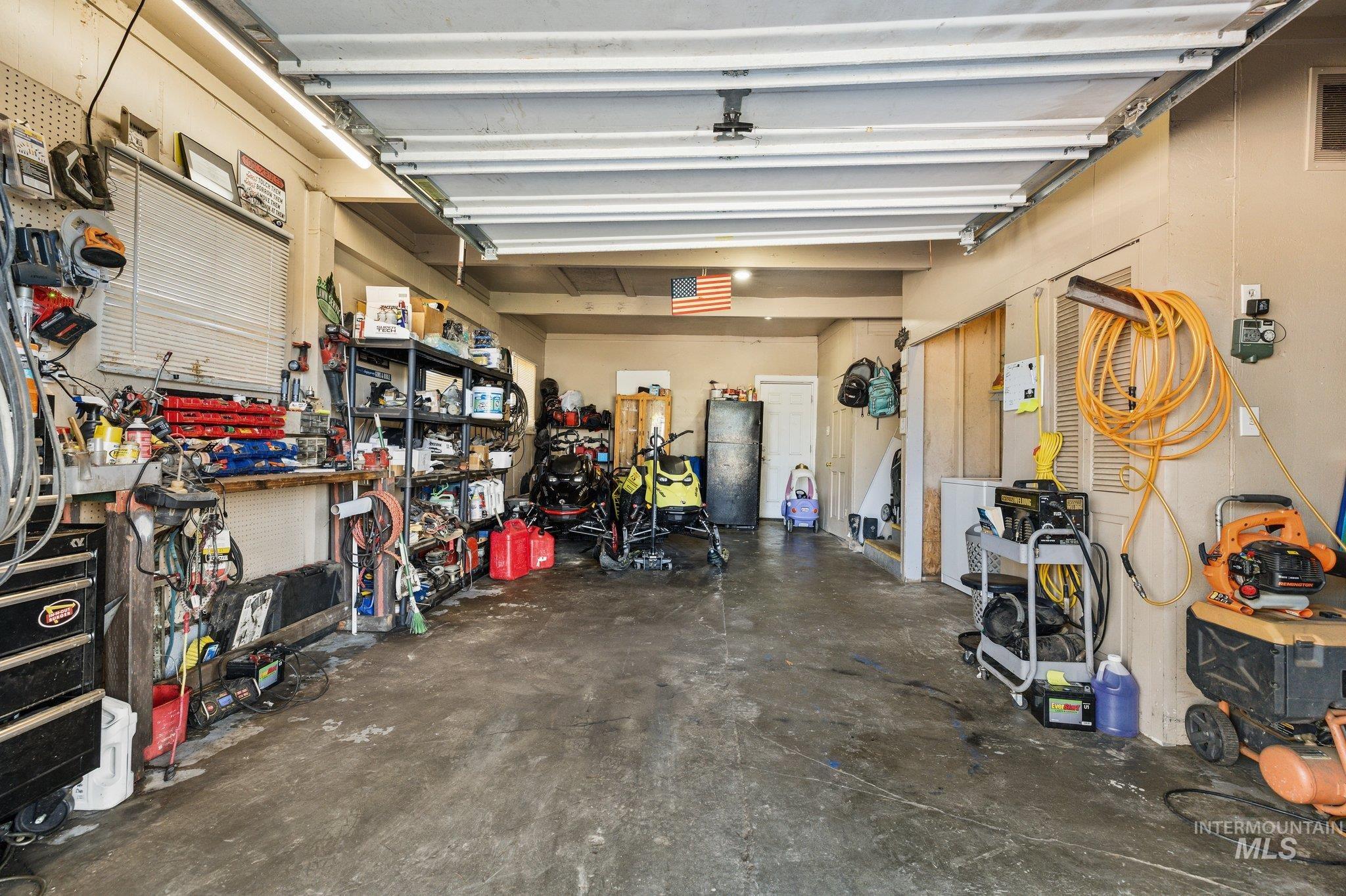 1504 2nd Street North Nampa, ID 83687 - Photo 23 of 29 Garage with a workshop area and a heating unit