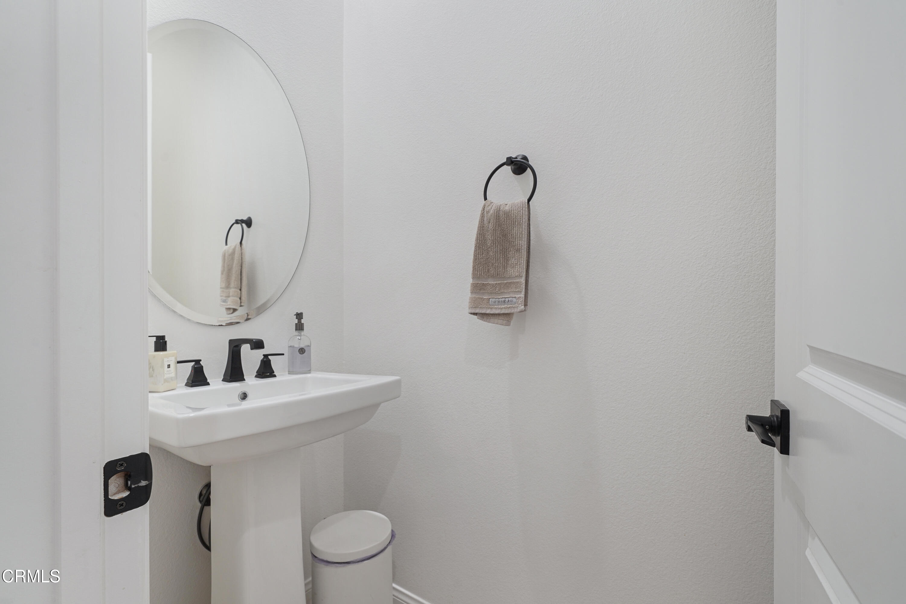 263 Wisteria Street Fillmore, CA 93015 - Photo 13 of 51 a bathroom with a toilet sink and mirror