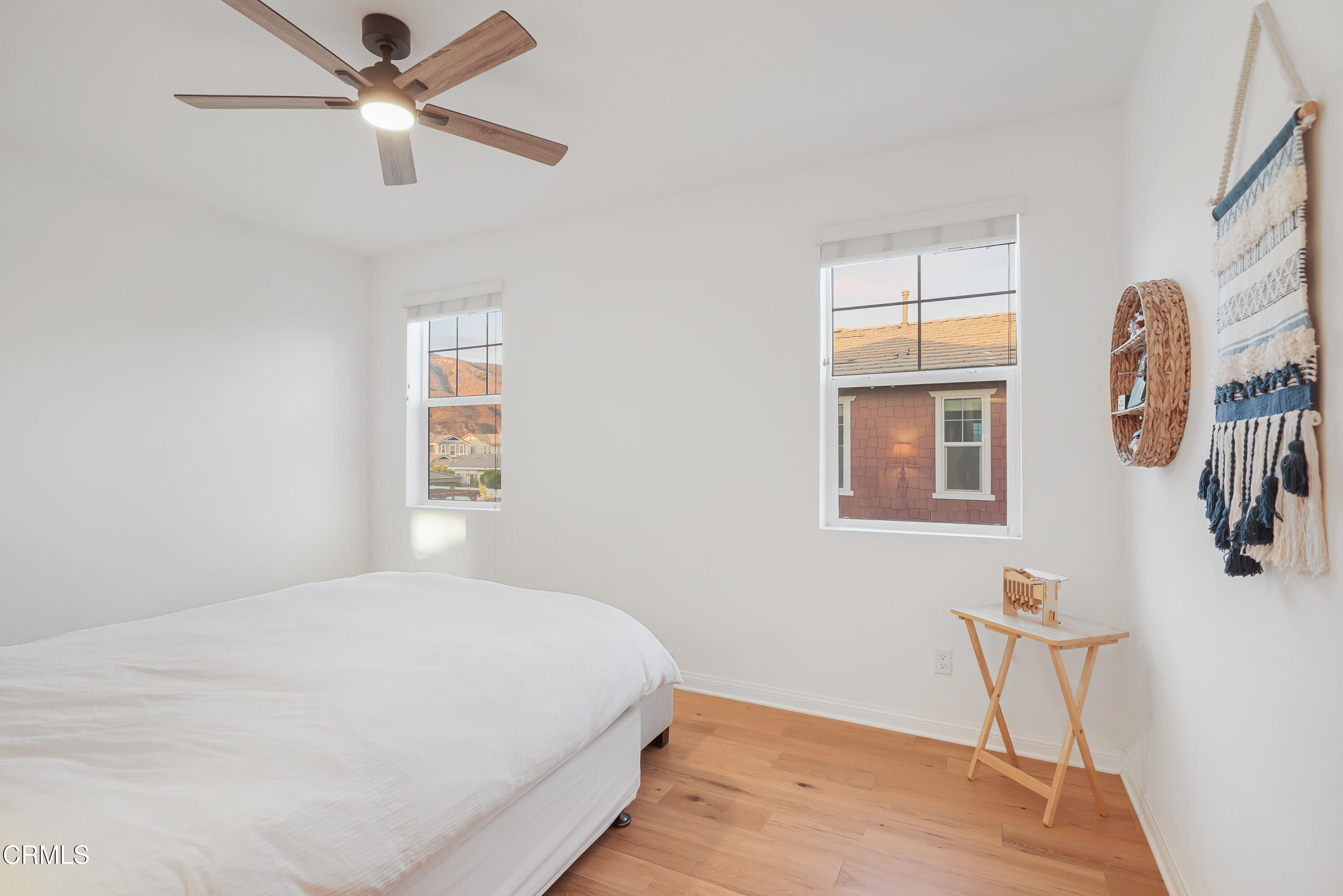 263 Wisteria Street Fillmore, CA 93015 - Photo 19 of 51 a bedroom with a bed and a chandelier