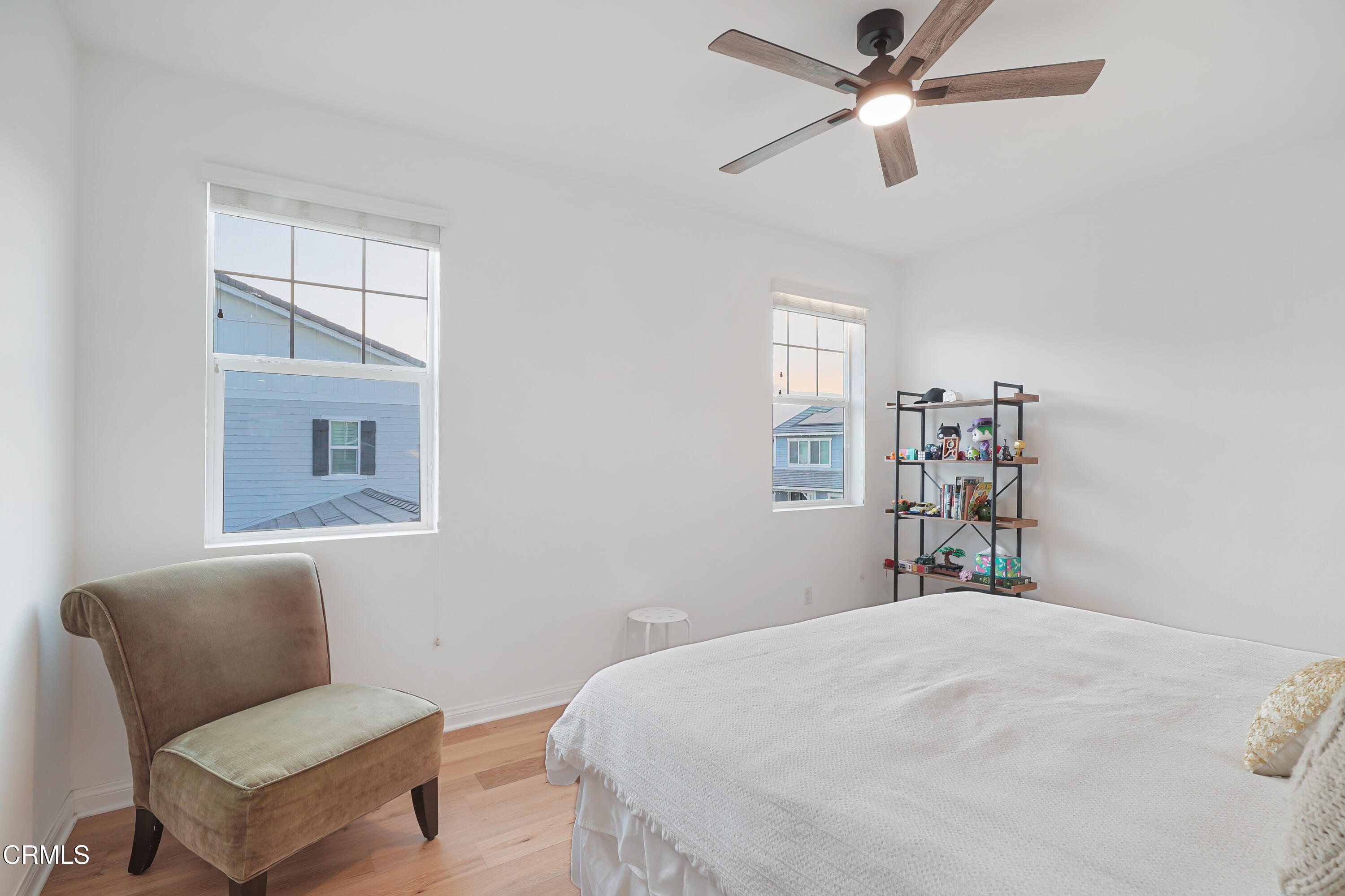 263 Wisteria Street Fillmore, CA 93015 - Photo 20 of 51 a bedroom with a bed and a chandelier