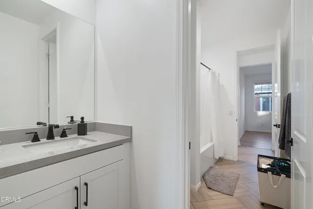 a bathroom with a sink and a mirror