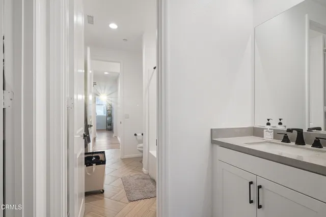 a view of kitchen with furniture and wooden floor