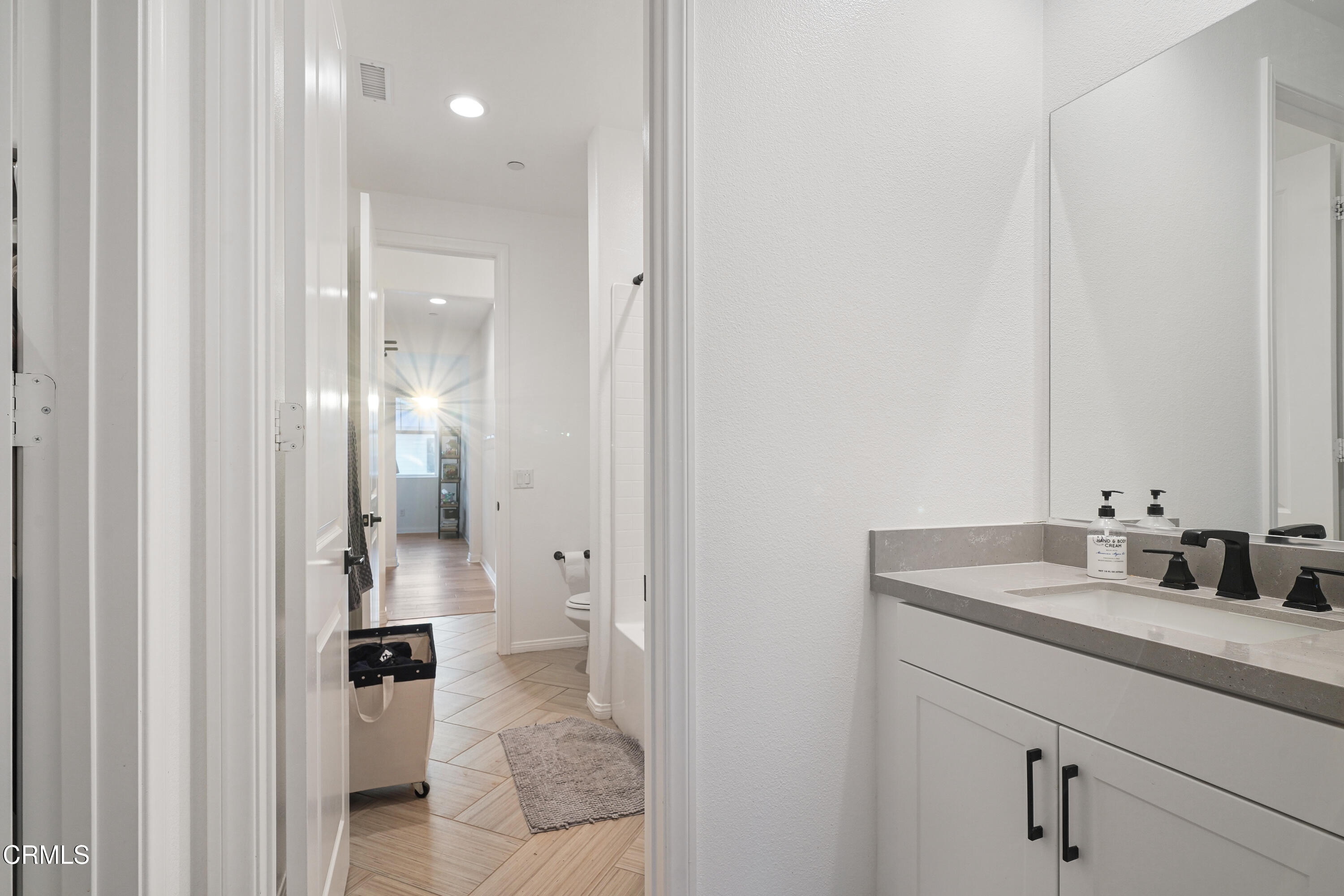 263 Wisteria Street Fillmore, CA 93015 - Photo 24 of 51 a bathroom with a sink and a mirror