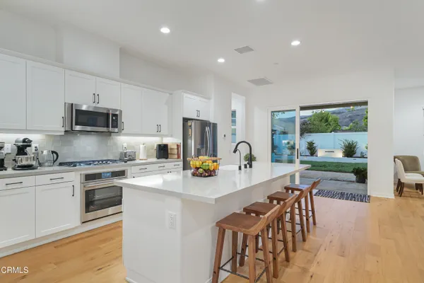 a living room with furniture and large window
