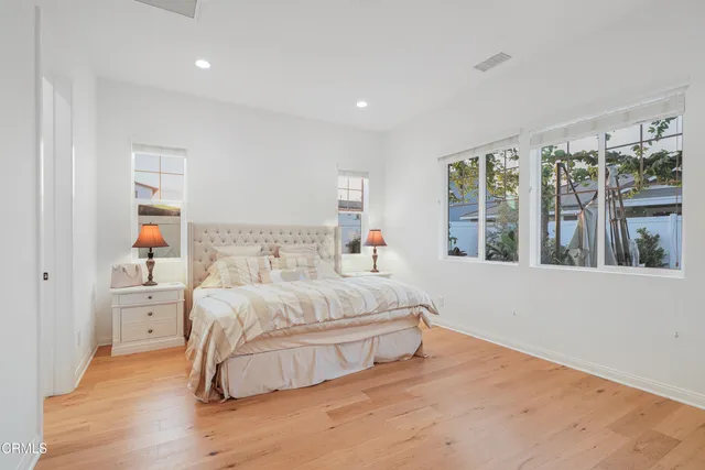 a bedroom with a bed and a dresser