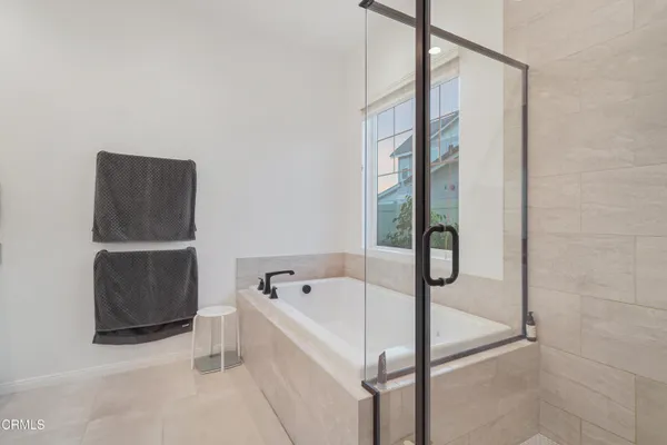 a bathroom with a double vanity sink and mirror