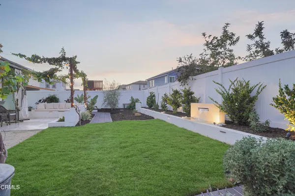 a view of a porch with chairs and table in a patio