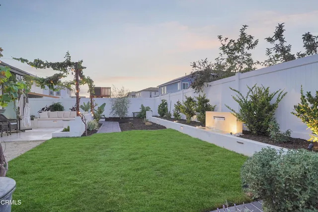 a view of a porch with chairs and table in a patio