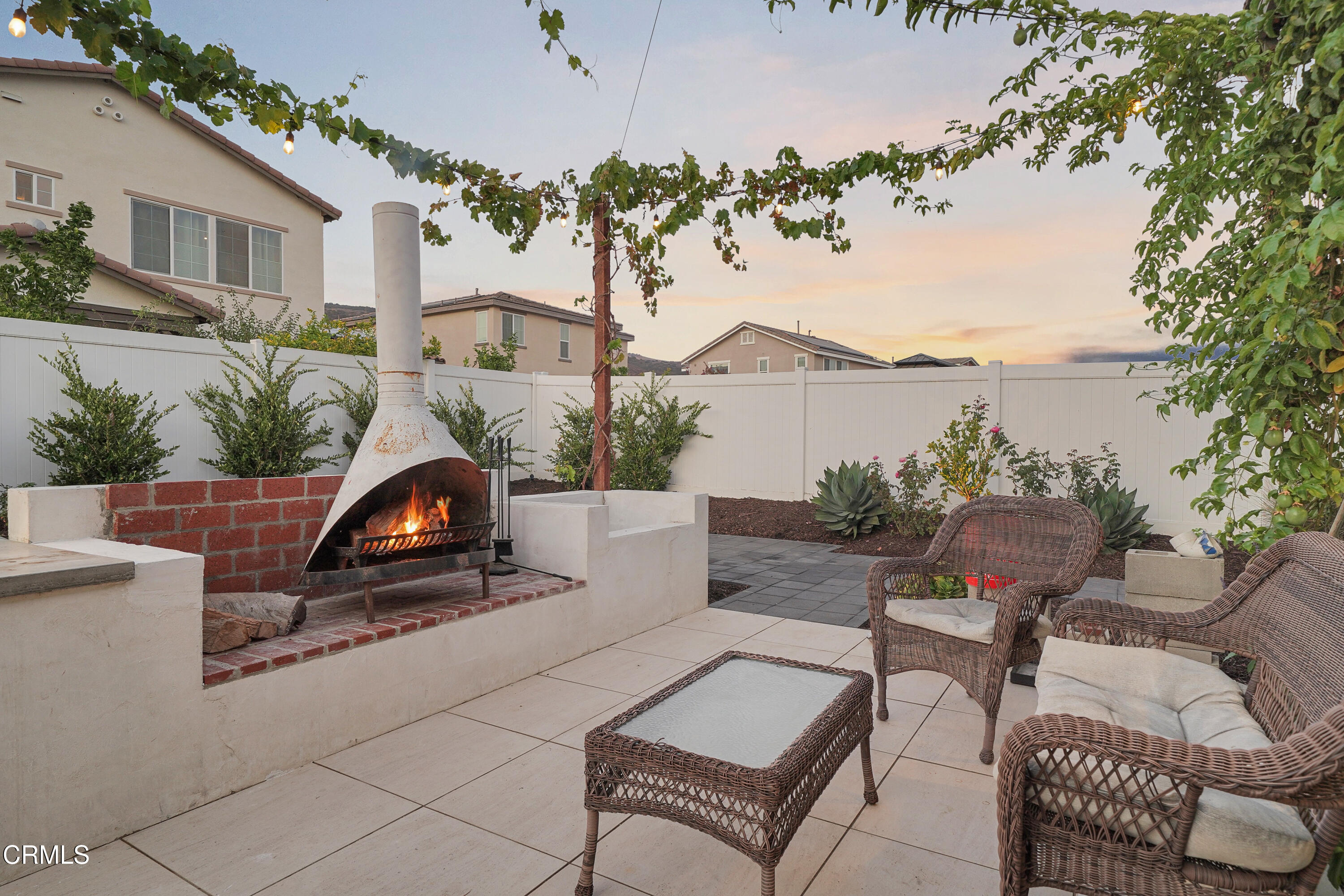 263 Wisteria Street Fillmore, CA 93015 - Photo 41 of 51 a view of a patio with couches table and chairs and potted plants