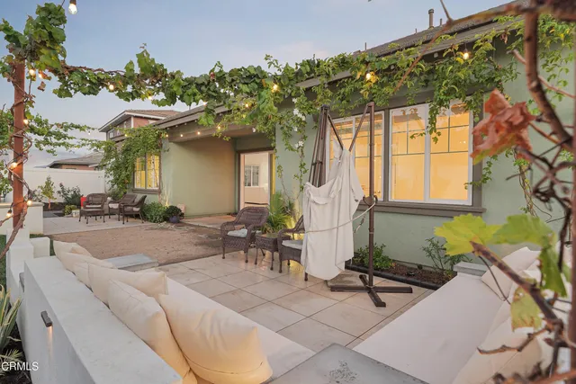 a view of a porch with furniture and plants