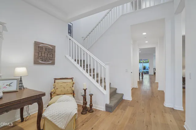 a view of a bedroom with a bed and a tv