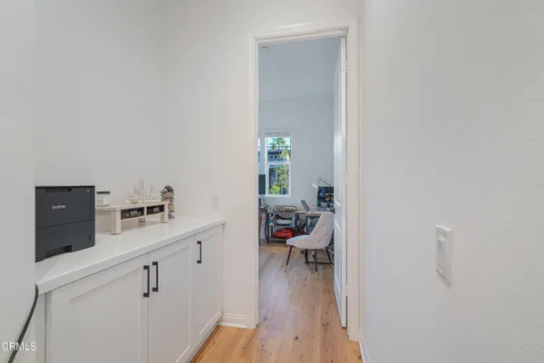 a living room with furniture window and a flat screen tv