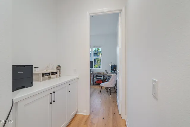 a living room with furniture window and a flat screen tv