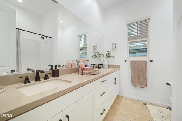 a workspace with furniture and a wooden floor