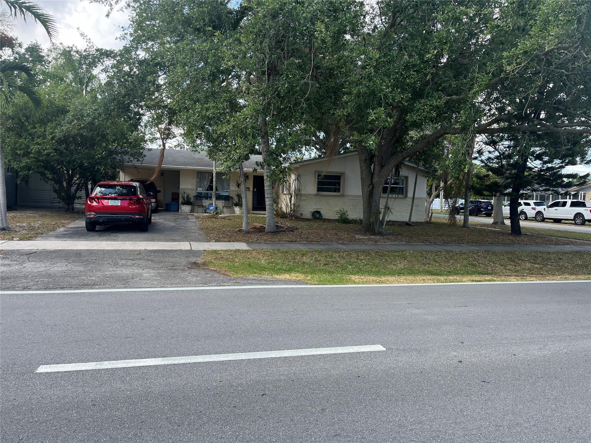 3401 West Park Road Hollywood, FL 33021 - Photo 1 of 28 a view of a house with a outdoor space