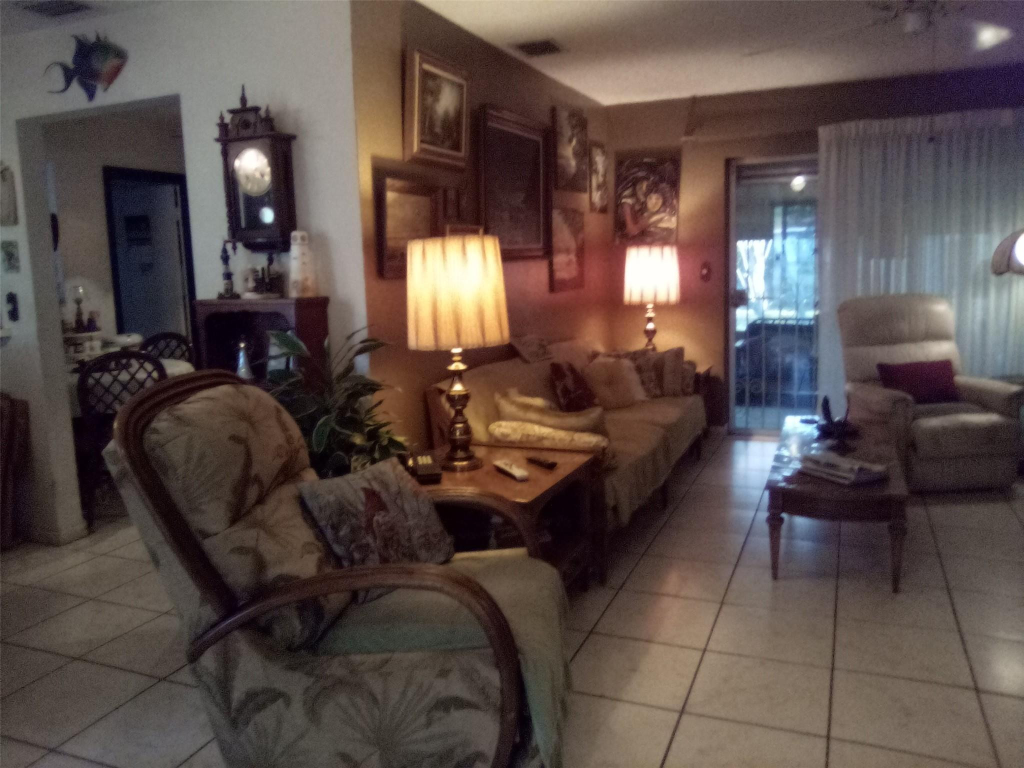 3401 West Park Road Hollywood, FL 33021 - Photo 7 of 28 a living room with furniture and a large mirror