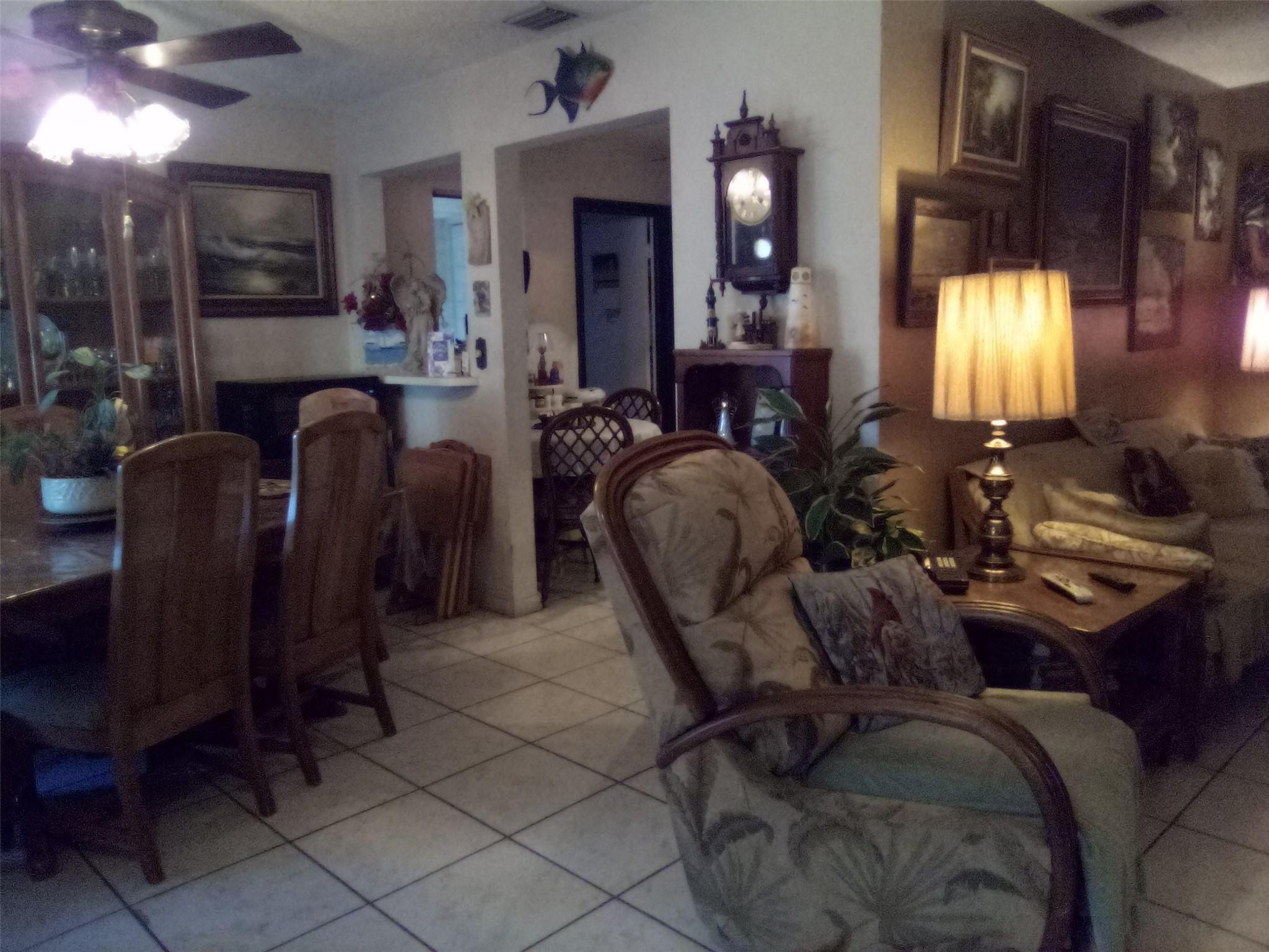 3401 West Park Road Hollywood, FL 33021 - Photo 8 of 28 a living room with furniture and a large mirror