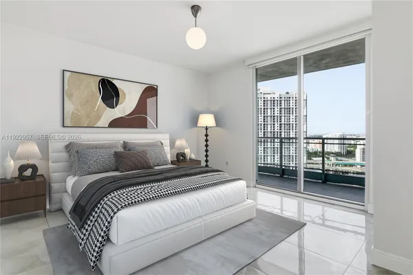 a bedroom with a bed and a window