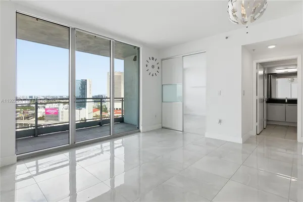 a view of a livingroom with a dinning table and chairs