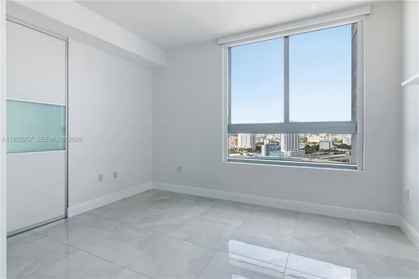 a view of an empty room with a window