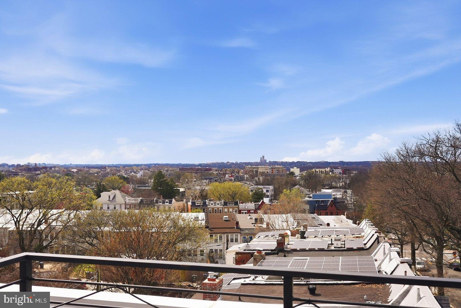 3922 3rd Street Northwest, Unit 2 Washington, DC 20011 - Photo 36 of 40 Panoramic cityscape under blue skies.