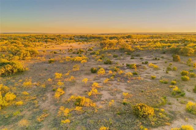 an aerial view of residential building and lake