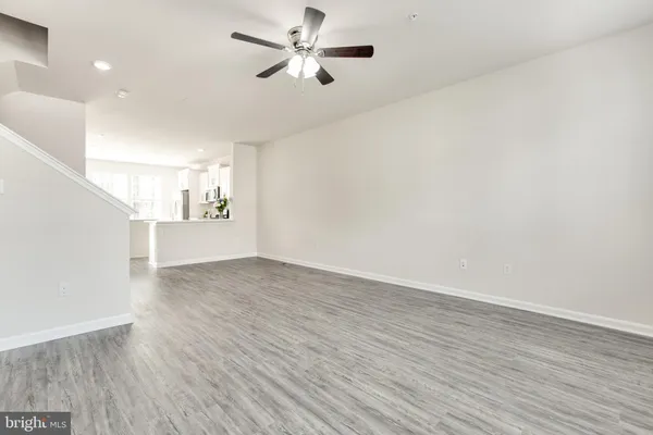 a kitchen with stainless steel appliances a refrigerator sink and microwave