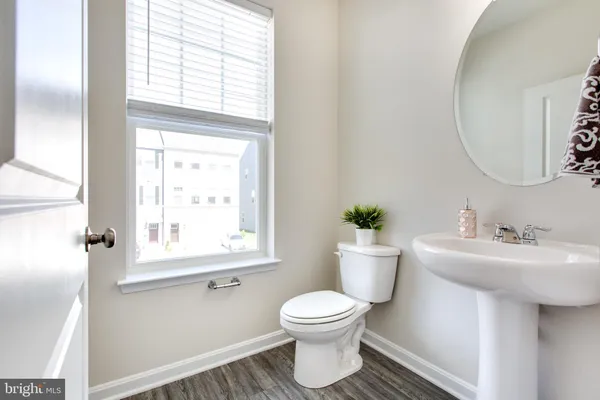 a bathroom with a double vanity sink mirror and shower