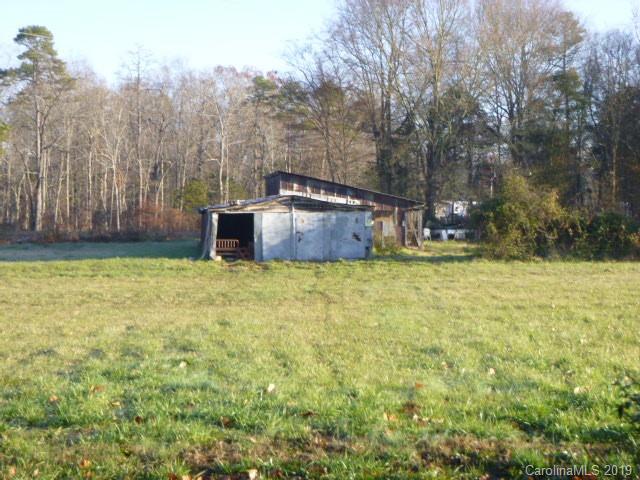 6506 Helms And Belk Road Monroe, NC 28110 - Photo 14 of 16 a view of a yard with large trees