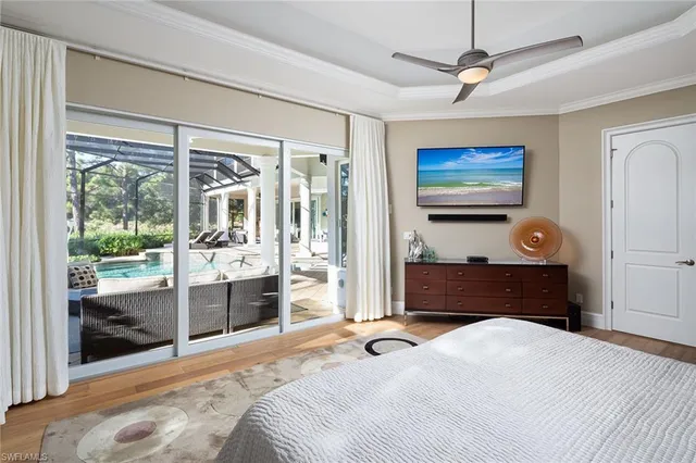 a large kitchen with kitchen island a large window in it