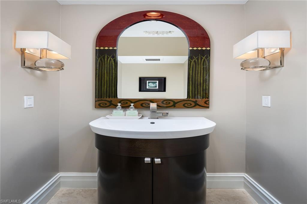 11617 Useppa Court Naples, FL 34110 - Photo 22 of 50 a bathroom with a sink and a mirror