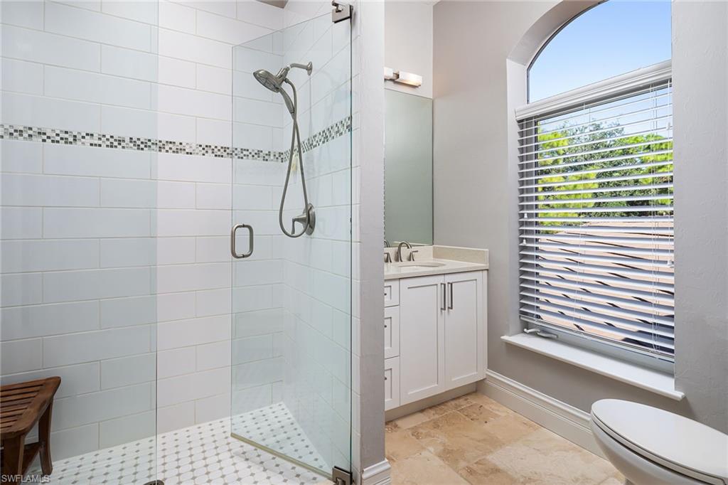 11617 Useppa Court Naples, FL 34110 - Photo 28 of 50 a bathroom with a sink a toilet and shower