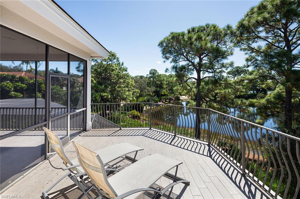 11617 Useppa Court Naples, FL 34110 - Photo 30 of 50 a view of a balcony with lake view and a potted plant