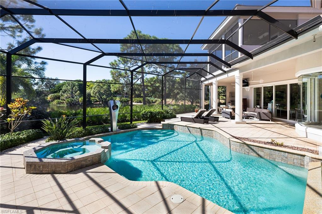 11617 Useppa Court Naples, FL 34110 - Photo 3 of 50 a view of a swimming pool with a patio