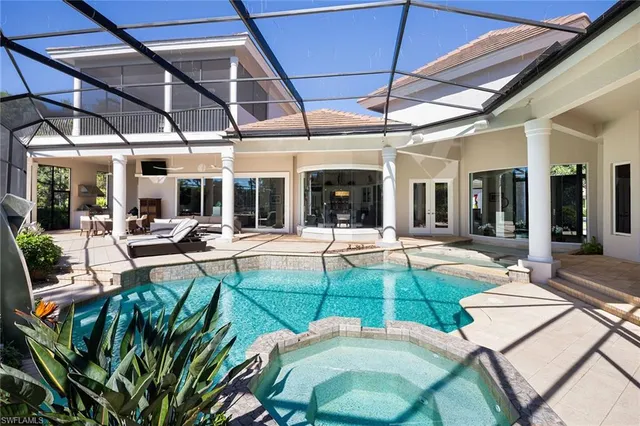 a view of a swimming pool with a patio