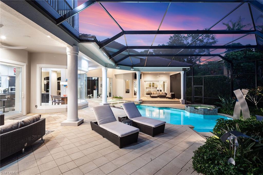 11617 Useppa Court Naples, FL 34110 - Photo 38 of 50 a living room with patio furniture and a potted plant