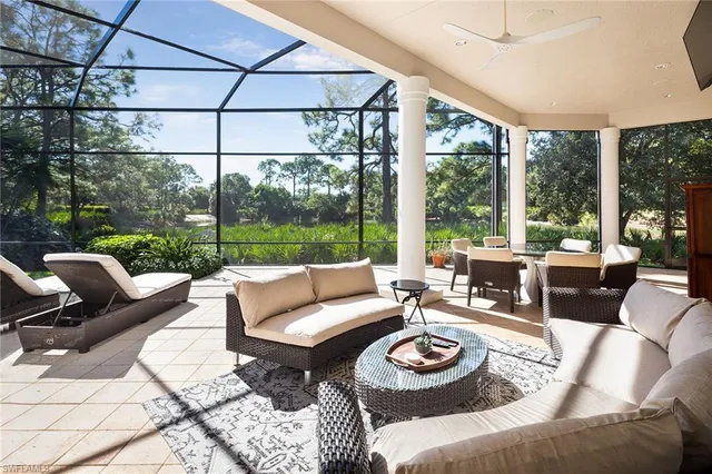 a open kitchen with stainless steel appliances granite countertop a barbecue grill and view of living room