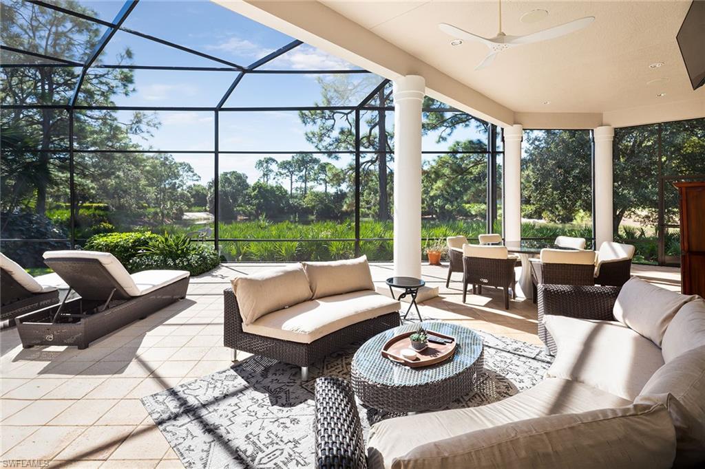 11617 Useppa Court Naples, FL 34110 - Photo 39 of 50 a living room with furniture and a large window