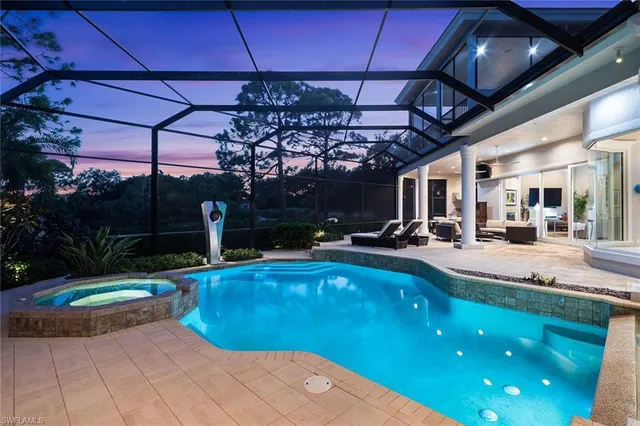 a view of a swimming pool with a patio