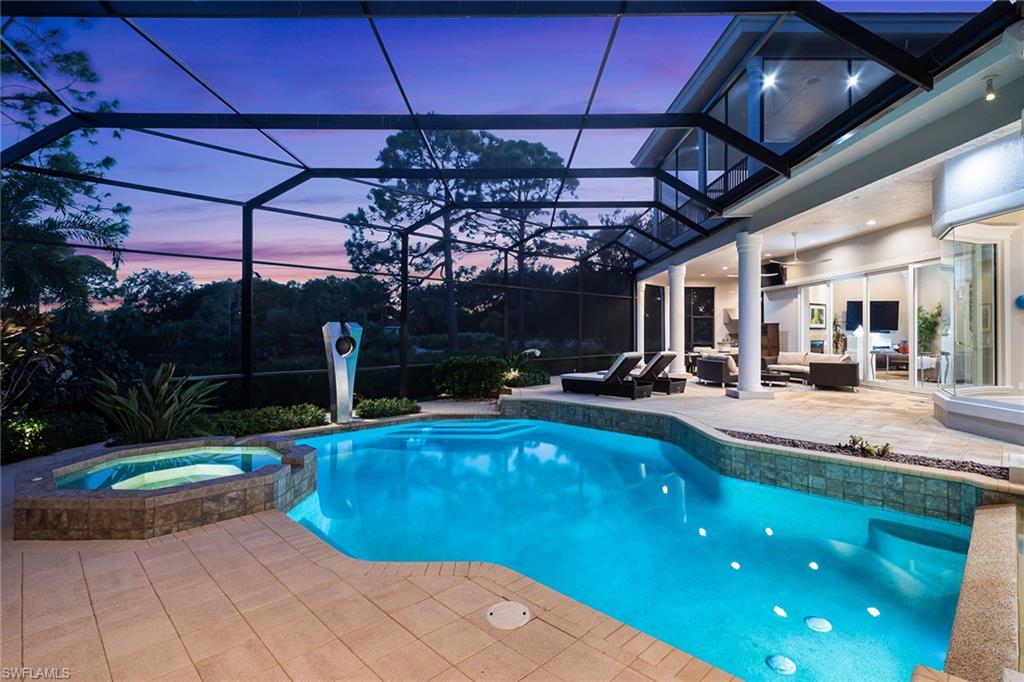 11617 Useppa Court Naples, FL 34110 - Photo 4 of 50 a view of a swimming pool with a patio