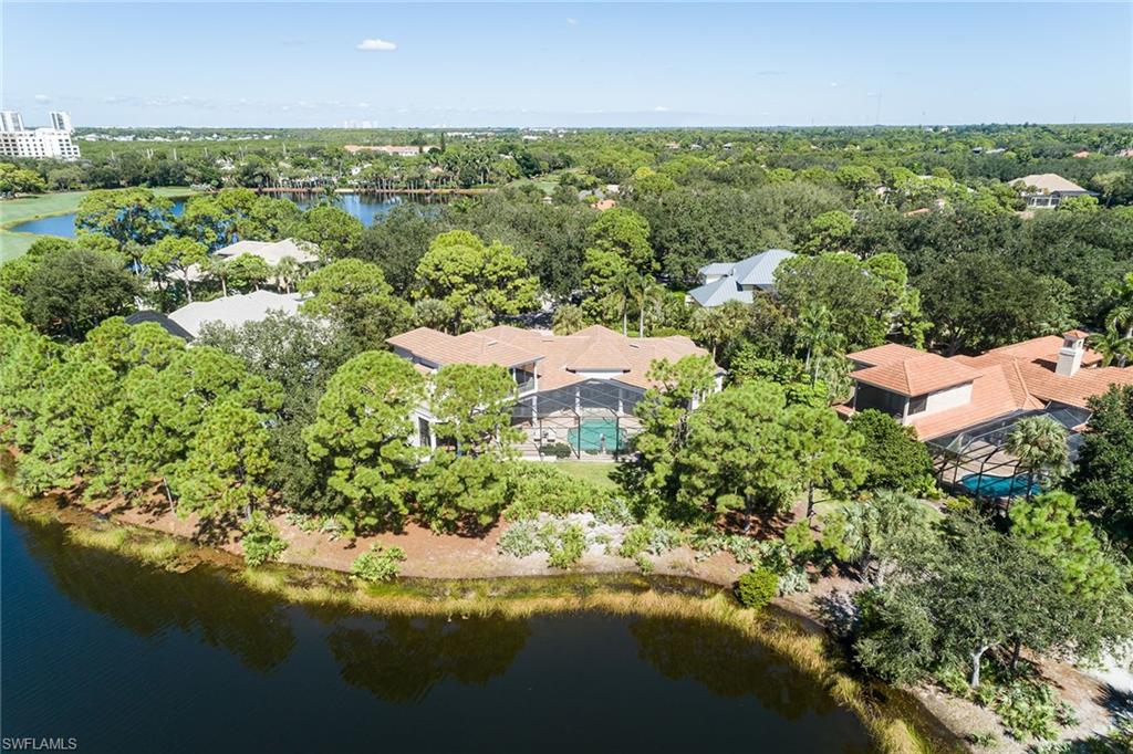 11617 Useppa Court Naples, FL 34110 - Photo 45 of 50 an aerial view of residential house with outdoor space and trees all around